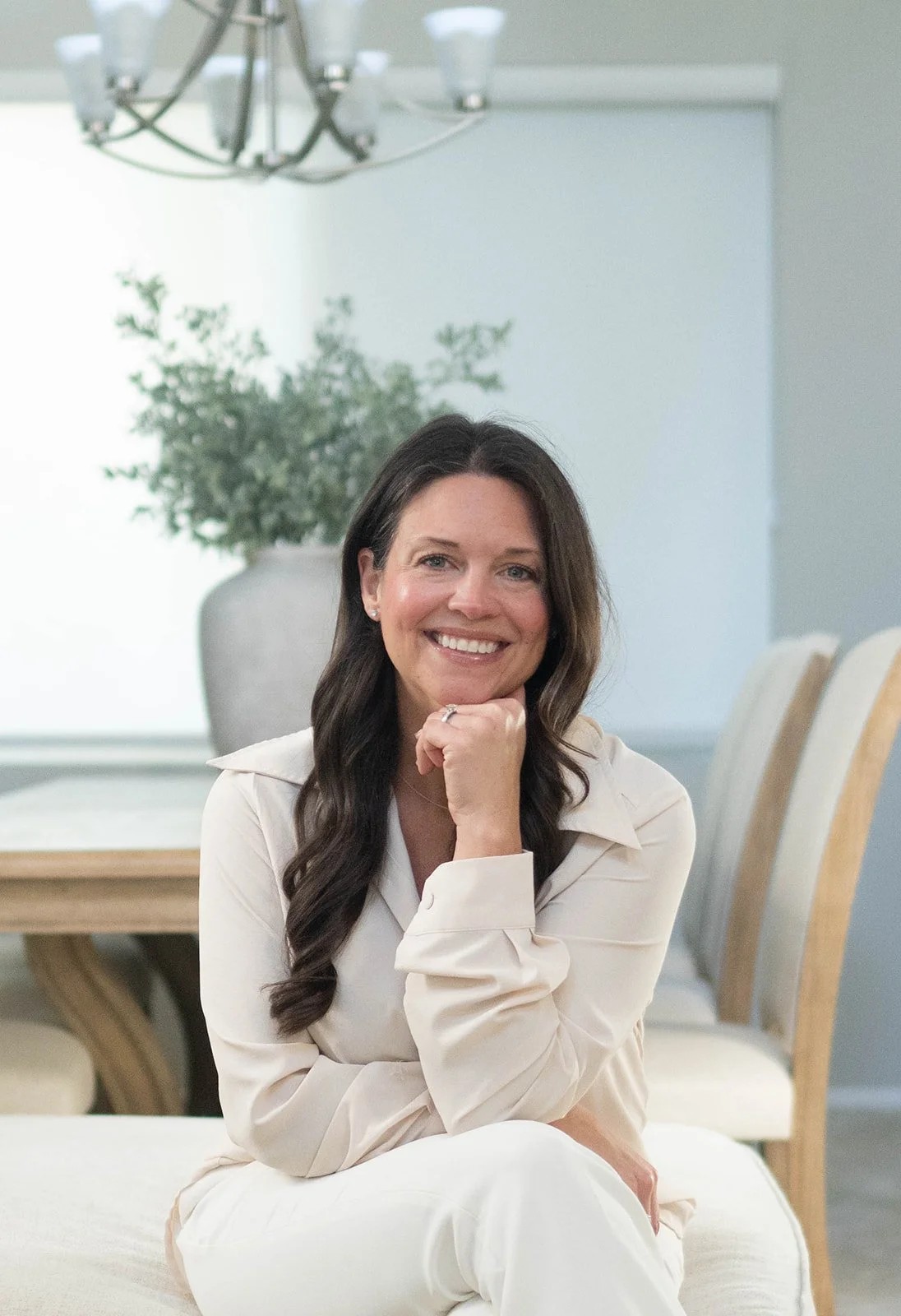 Woman reviewing trading charts on laptop deciding when to switch from demo to live account
